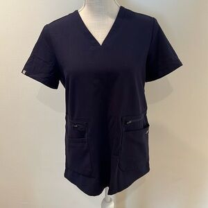 Figs navy scrub top with tropical design on sides